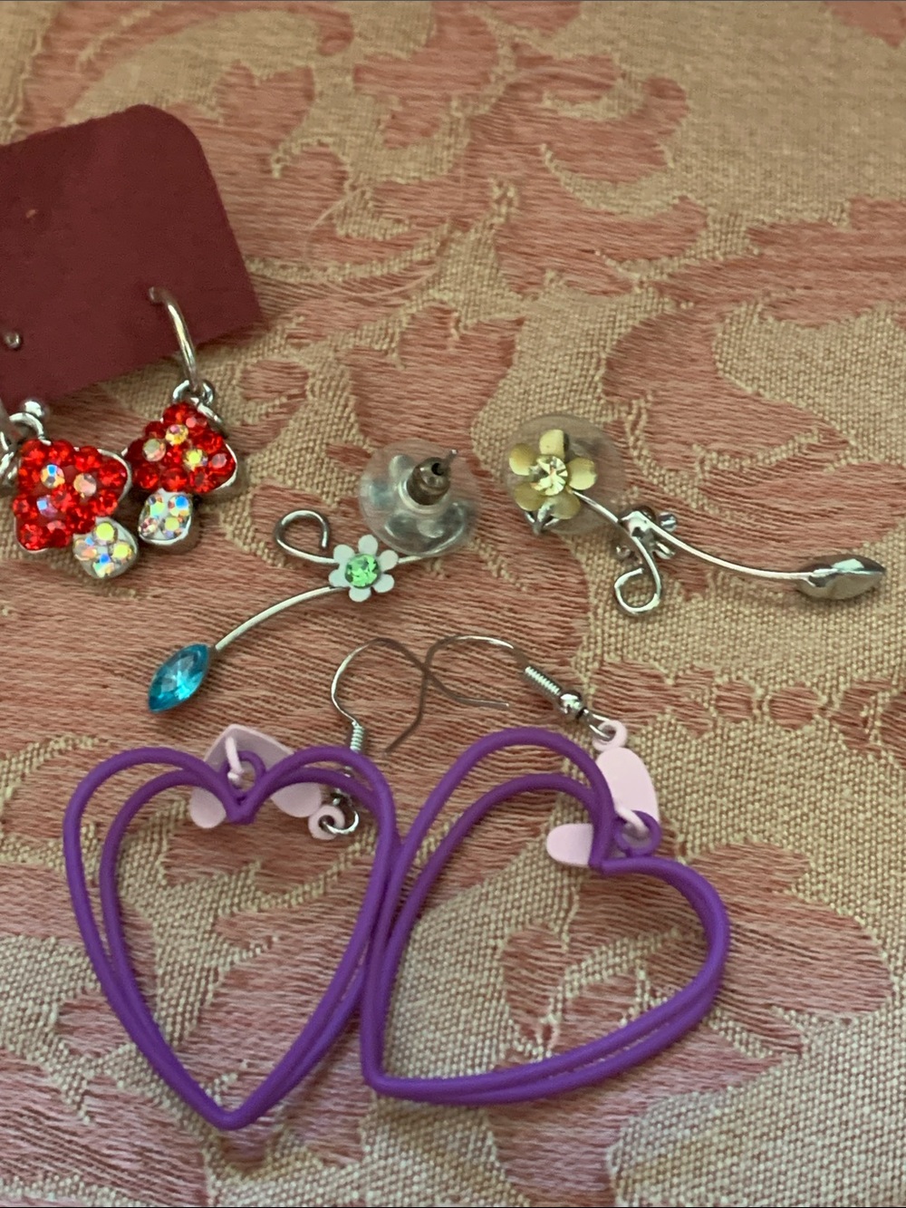 Earrings that include mushrooms hearts and flowers CHARMING